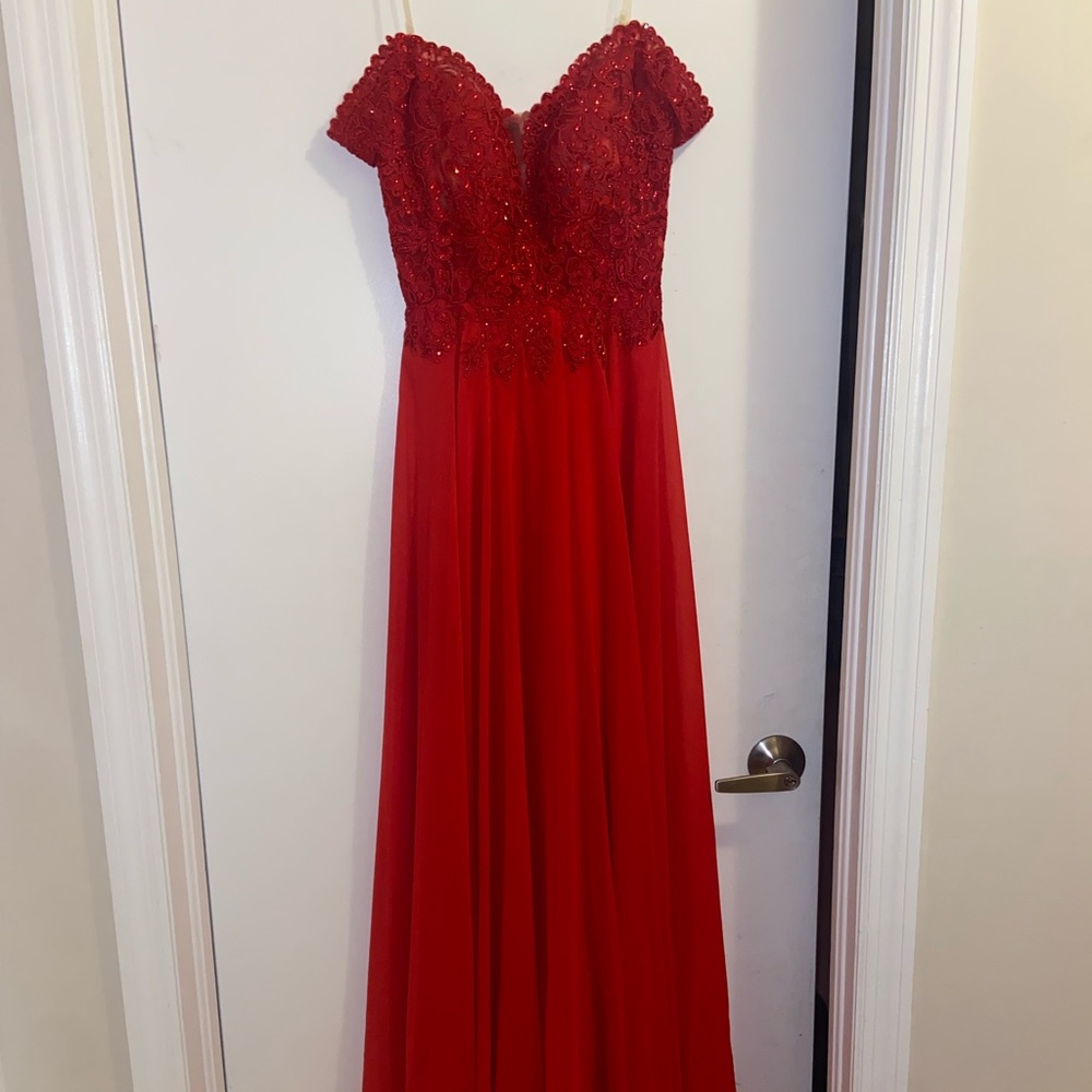 A beautiful red dress that is perfect for any fancy event or prom.